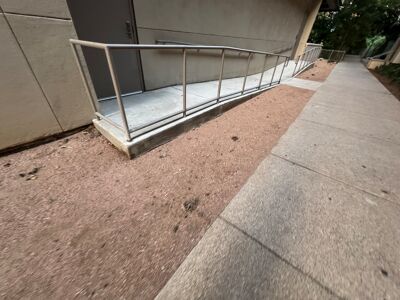 Pet waste collects outside The Bowie, contaminating nearby Shoal Creek and other Austin waterways.