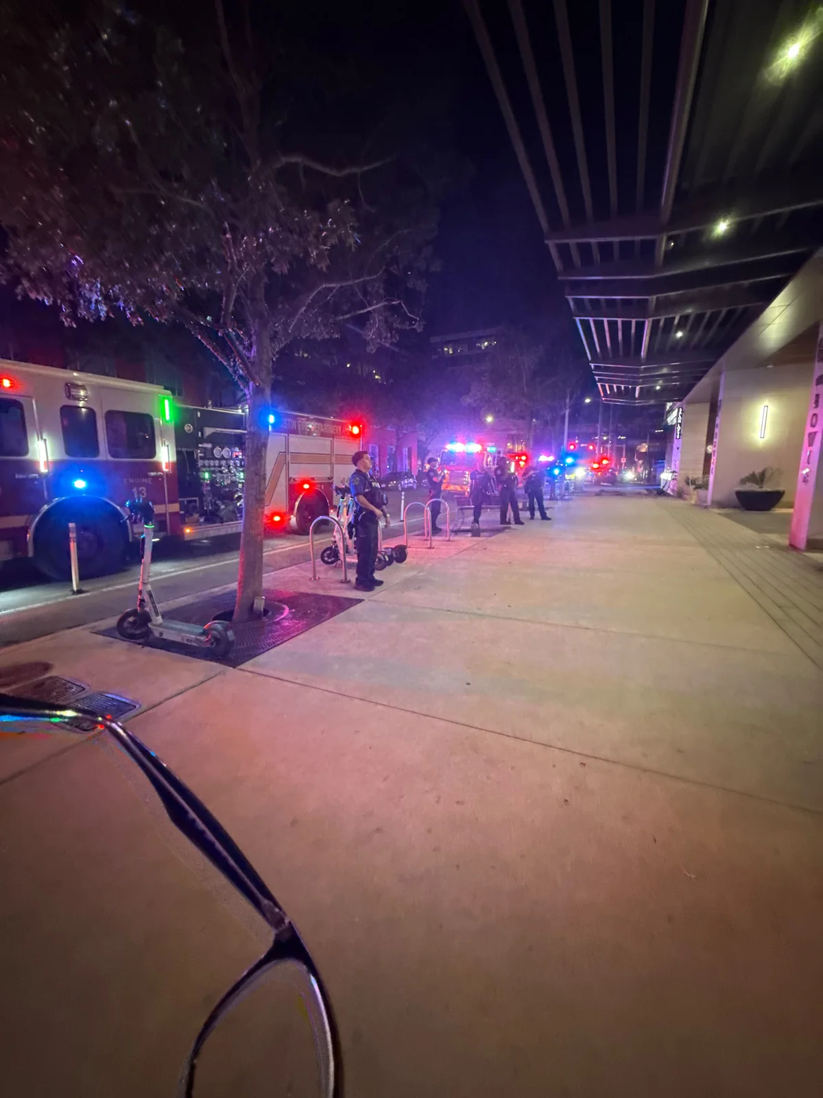 Emergency vehicles responding near The Bowie apartments in Austin at night